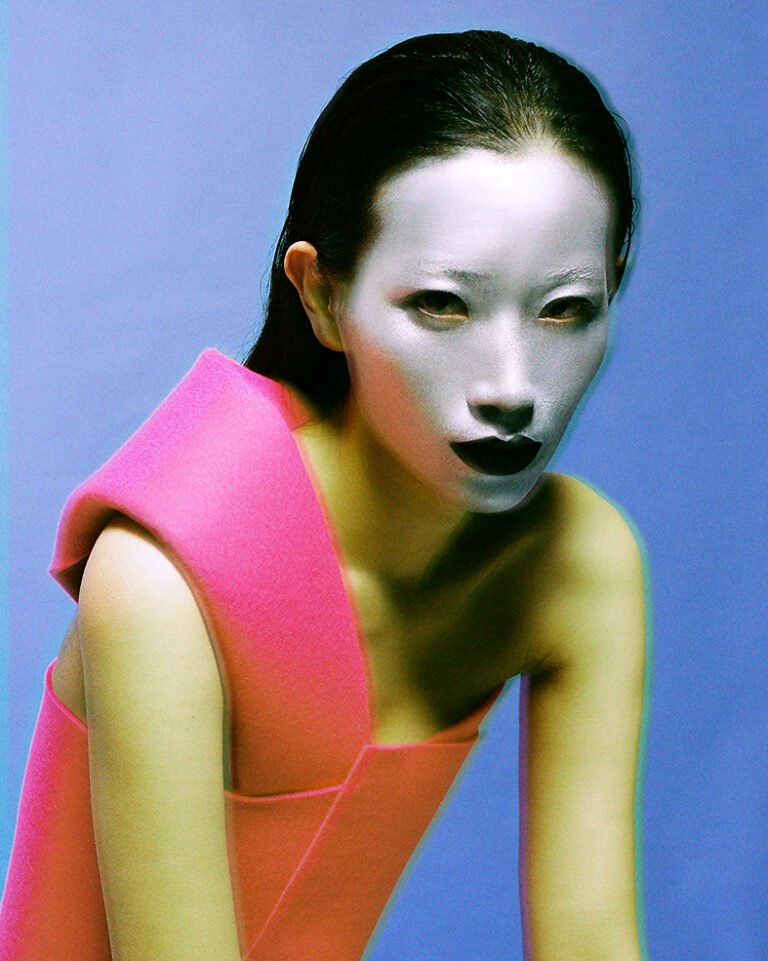 Portrait of a makeup model with her face painted white