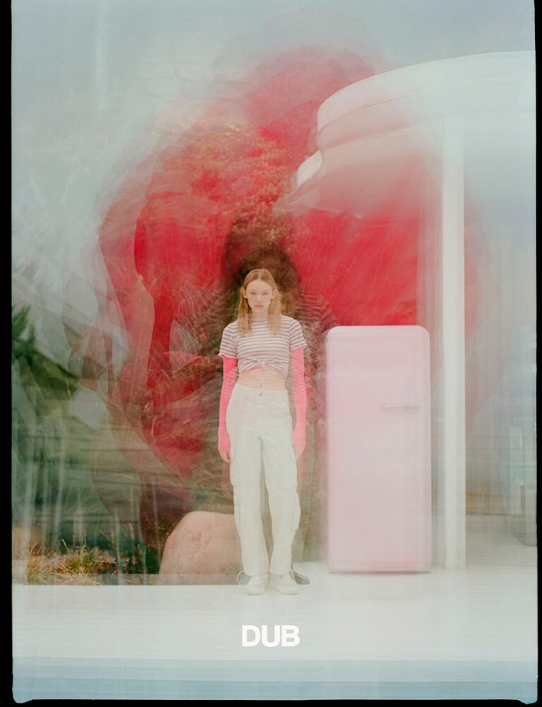 Double exposure photograph of a model during an urban fashion photoshoot