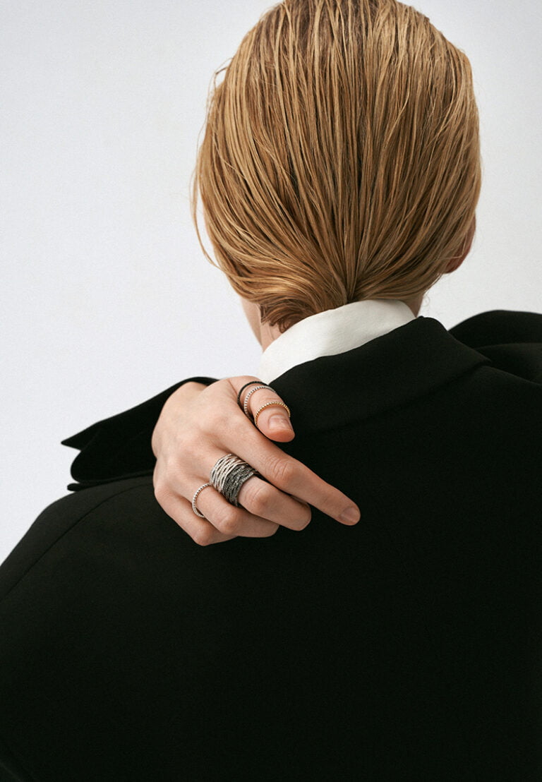 Model's hand with many rings. Jewellery photography.