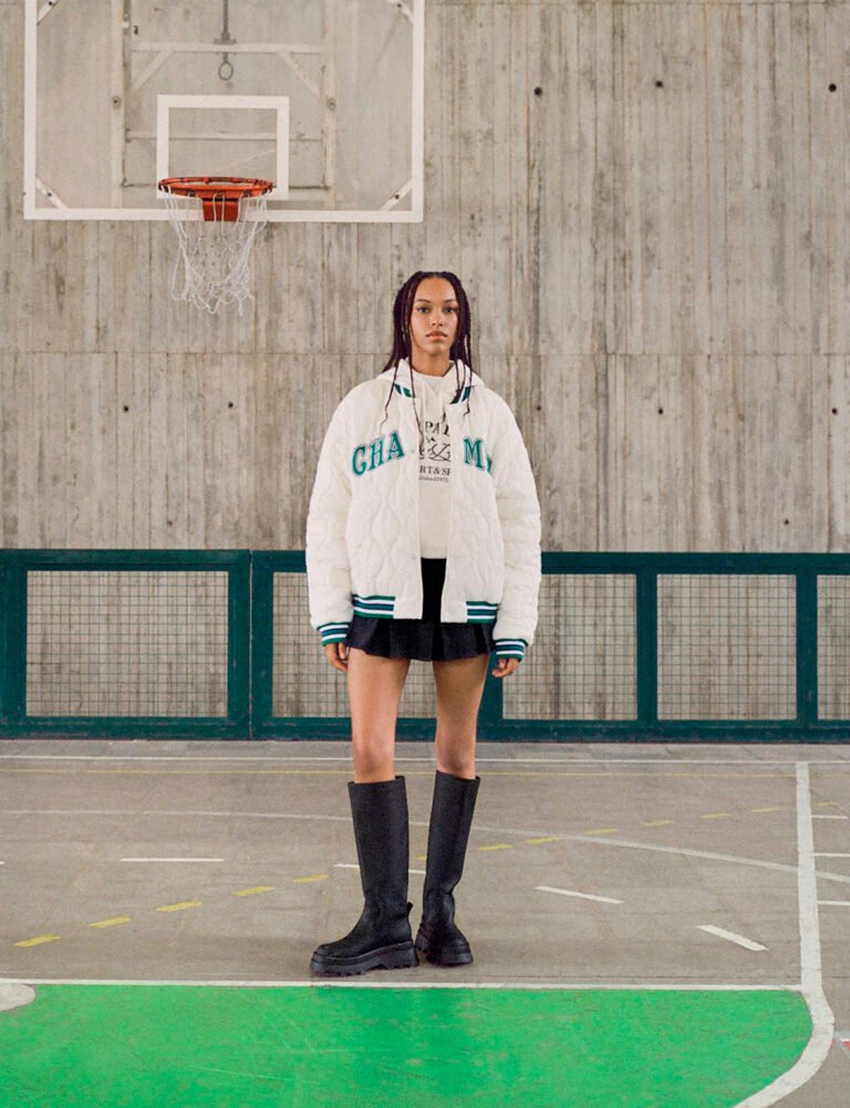 A young woman in sportswear in a gym. Editorial photography.