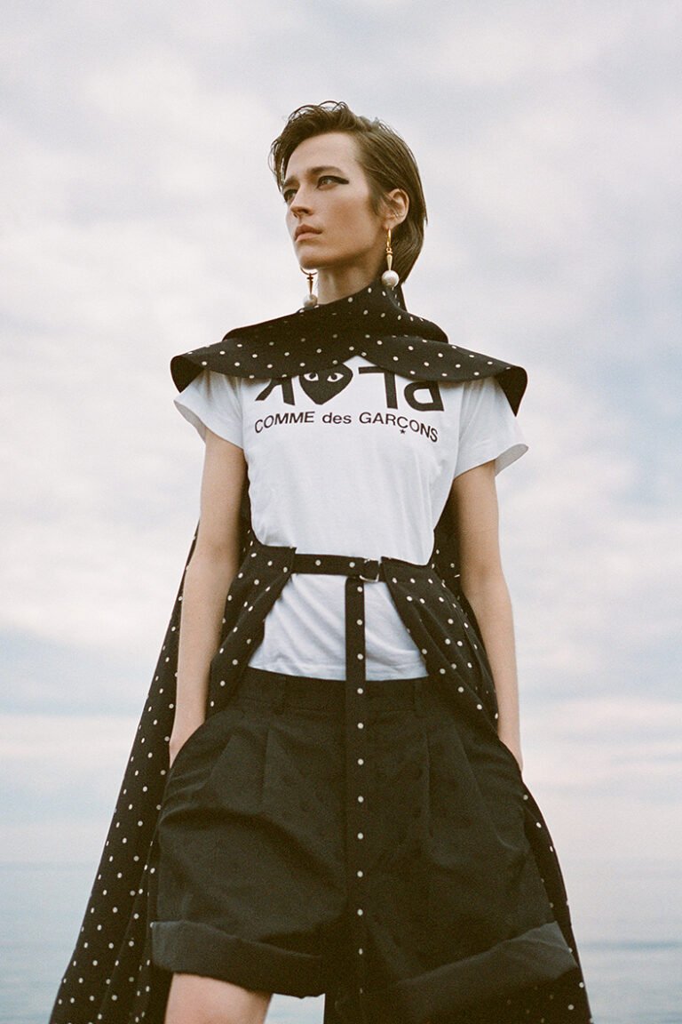 Photograph of a model in COMME DES GARÇONS t-shirt.