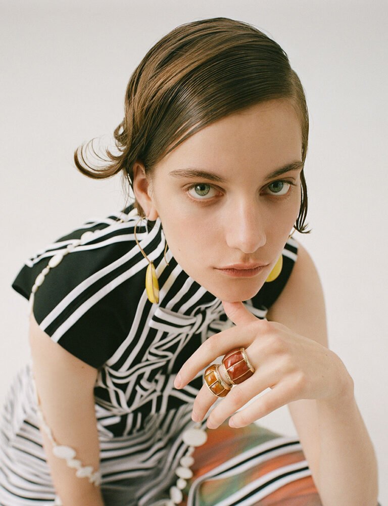 Portrait of a model with two big rings on her finger