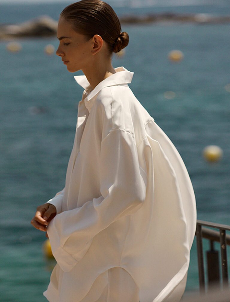 Fashion model wearing a large white shirt