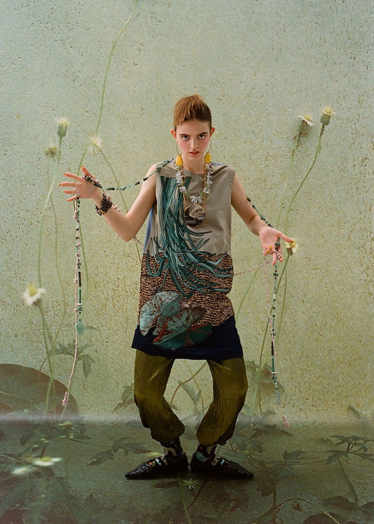 Fashion photography. Young model in a dress wearing jewellery.