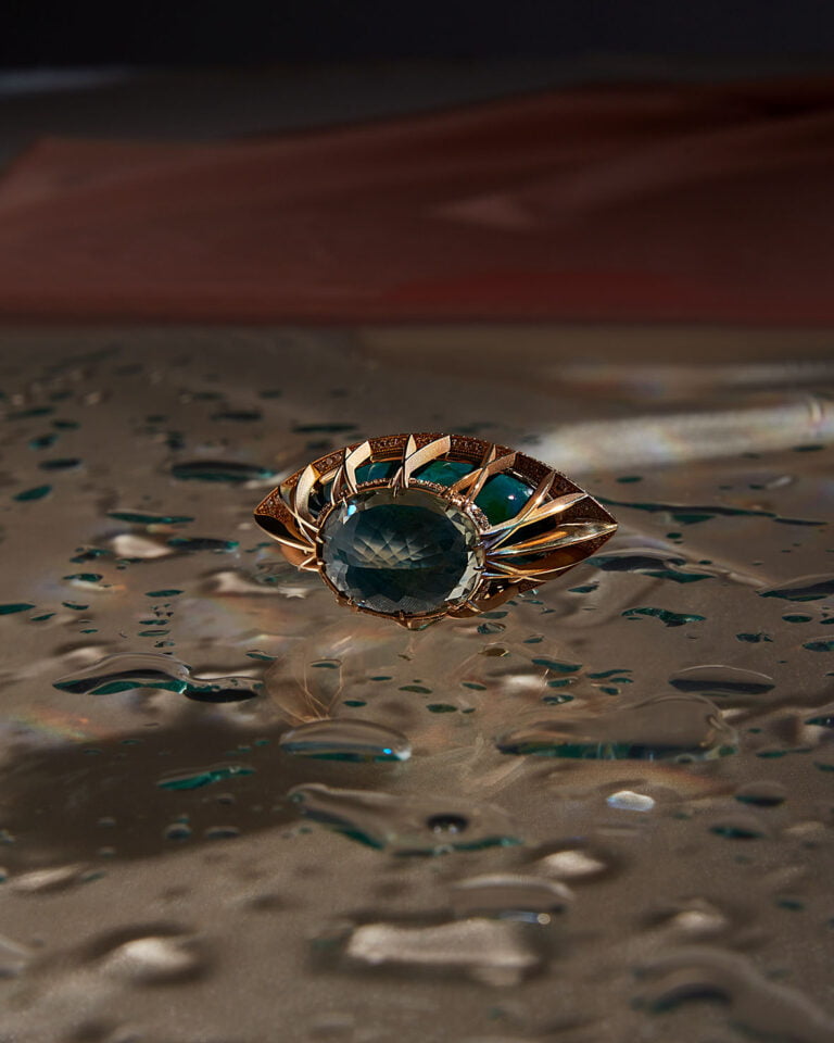 Piece of jewellery with a blue stone close up