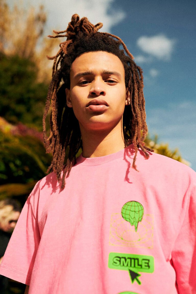 Portrait of a young male model in a pink t-shirt