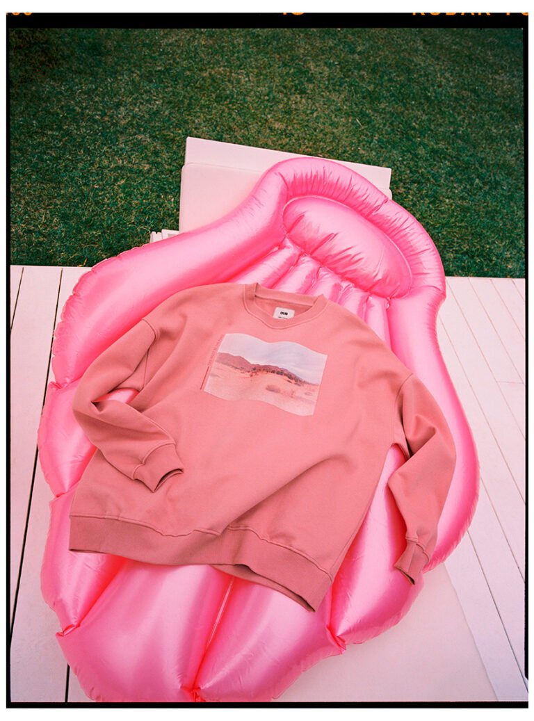 Pink sweatshirt on top of a pink inflatable mattress