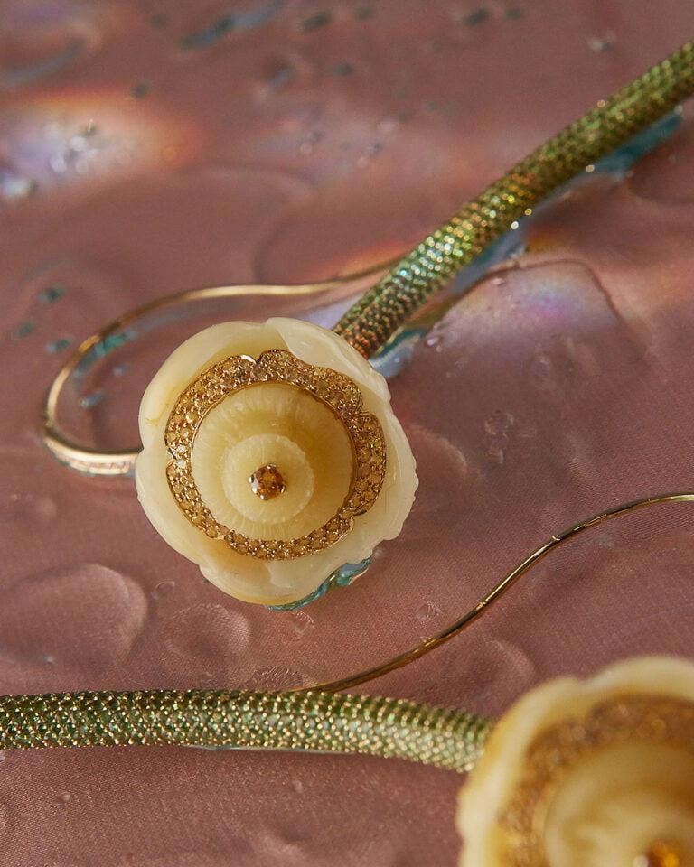 Close-up photograph of two flower shaped earrings