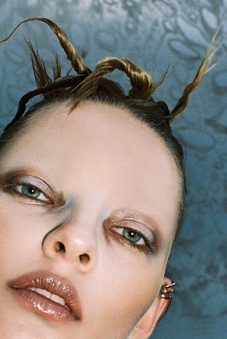 Close-up face of a model with her hair styled. Beauty photography.