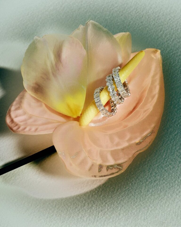 Nude Jewelry, three earrings inside Calla flower