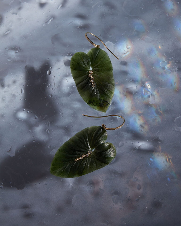 Photograph of two green leaf earrings